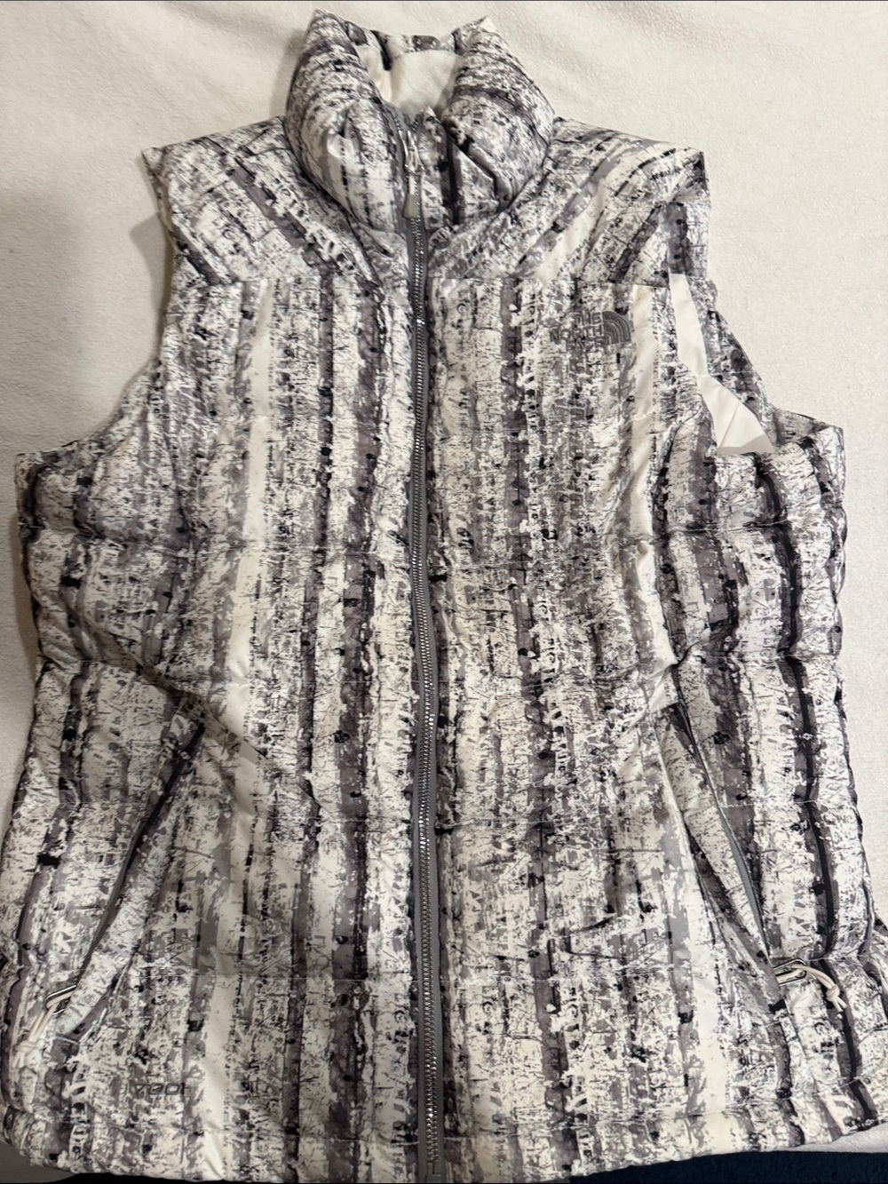 The North Face Quilted Hooded Vest in White and Gray Stripes